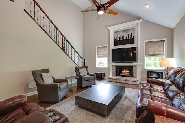2550 Bayswater Cir, Gurnee, IL 60031 - living area with a fireplace, wood finished floors, a ceiling fan, high vaulted ceiling, and baseboards
