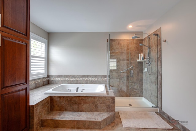 2550 Bayswater Cir, Gurnee, IL 60031 - full bathroom with a garden tub, a shower stall, and tile patterned flooring