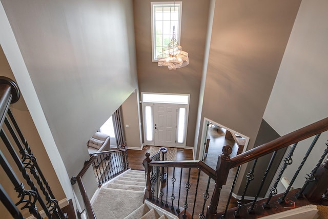 2550 Bayswater Cir, Gurnee, IL 60031 - entrance foyer featuring a towering ceiling, healthy amount of natural light, baseboards, stairs, and a chandelier