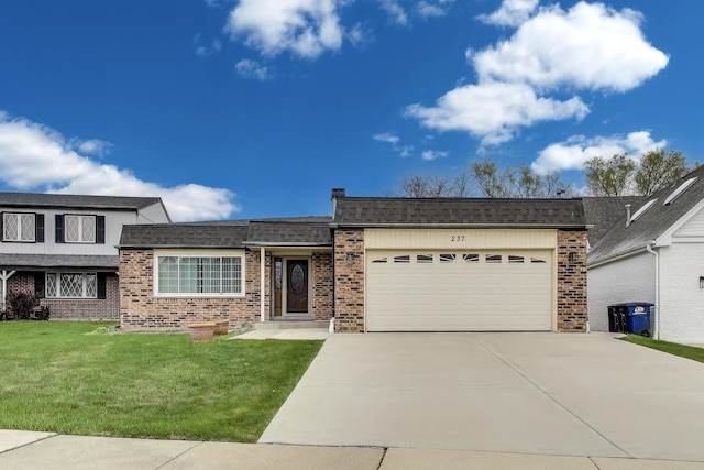 view of front facade with a garage, concrete driveway, a front yard, and brick siding