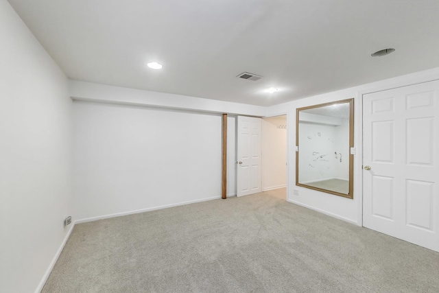 finished basement with baseboards, carpet flooring, recessed lighting, and visible vents