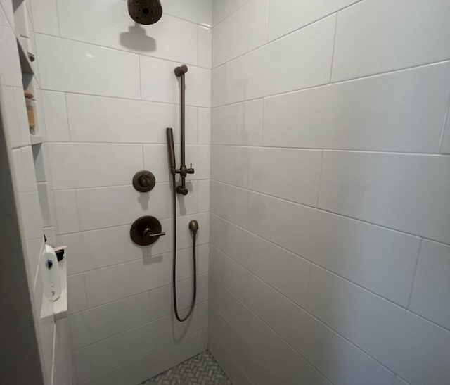 full bathroom with tiled shower