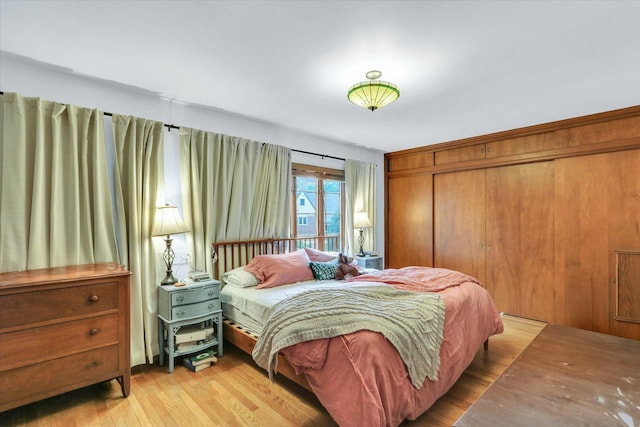 902 W William St, Champaign, IL 61821 - bedroom featuring wood finished floors and a closet