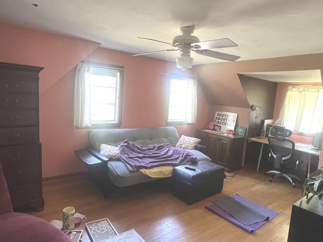 bedroom with light wood-style floors and a ceiling fan