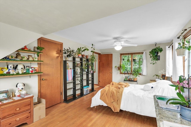 902 W William St, Champaign, IL 61821 - bedroom with light wood-style floors and a ceiling fan