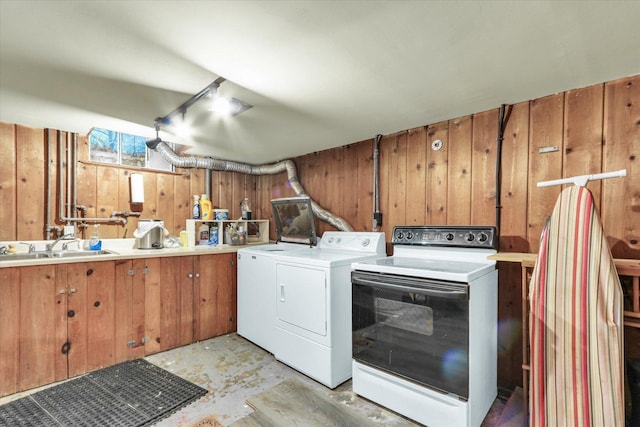 902 W William St, Champaign, IL 61821 - laundry room with washing machine and clothes dryer and wood walls