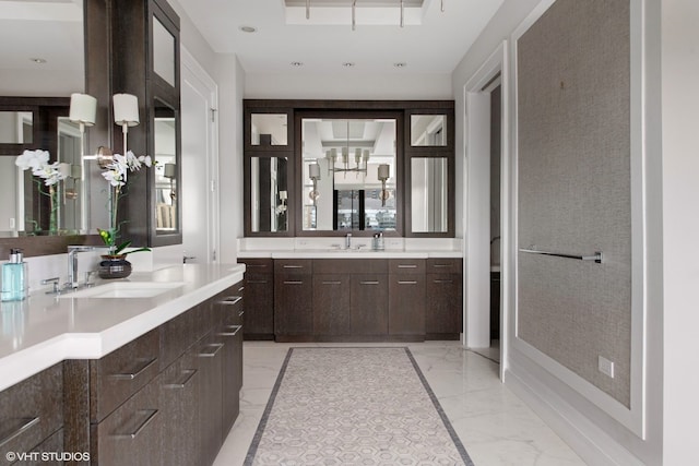 400 W Ontario St Unit 1801, Chicago, IL 60654 - bathroom with marble finish flooring, a chandelier, and two vanities