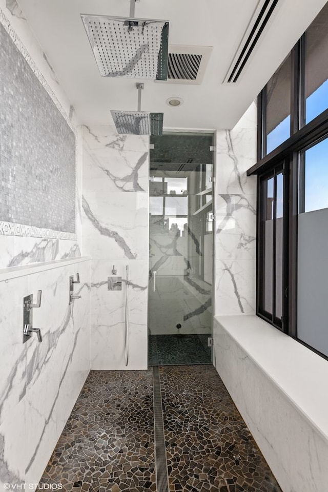 400 W Ontario St Unit 1801, Chicago, IL 60654 - full bath with a marble finish shower and stone wall