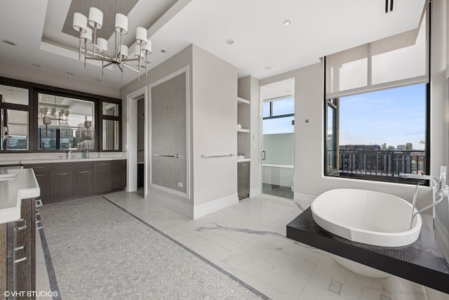 400 W Ontario St Unit 1801, Chicago, IL 60654 - bathroom with marble tiled flooring, a chandelier, vanity, baseboards, and recessed lighting