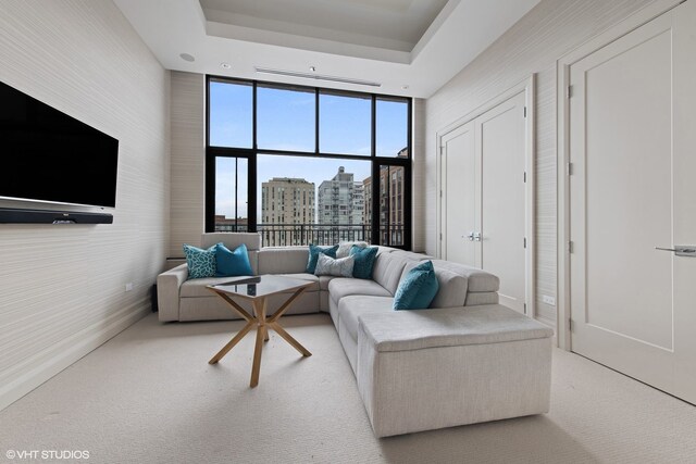 400 W Ontario St Unit 1801, Chicago, IL 60654 - carpeted living room featuring a tray ceiling, expansive windows, and a city view