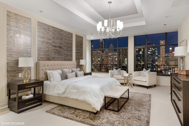 400 W Ontario St Unit 1801, Chicago, IL 60654 - bedroom with a chandelier, a tray ceiling, and a view of city lights