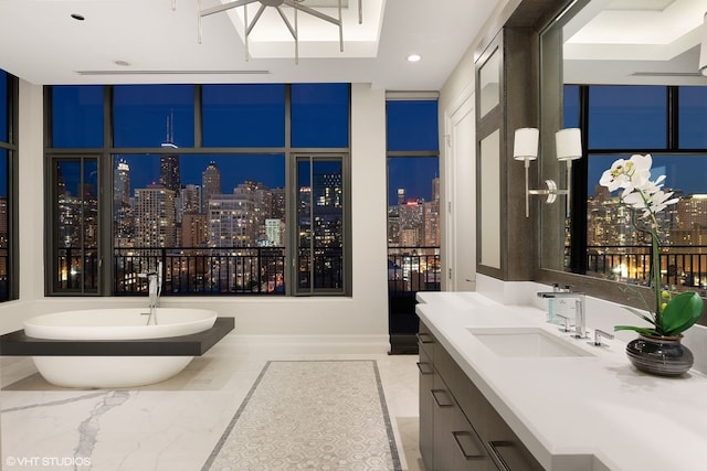 400 W Ontario St Unit 1801, Chicago, IL 60654 - full bath featuring marble tiled flooring, a view of city lights, a freestanding bath, vanity, and recessed lighting
