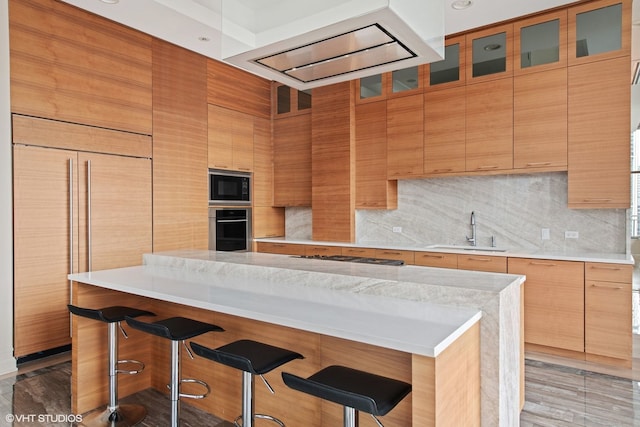 400 W Ontario St Unit 1801, Chicago, IL 60654 - kitchen with a sink, built in appliances, a kitchen bar, and backsplash