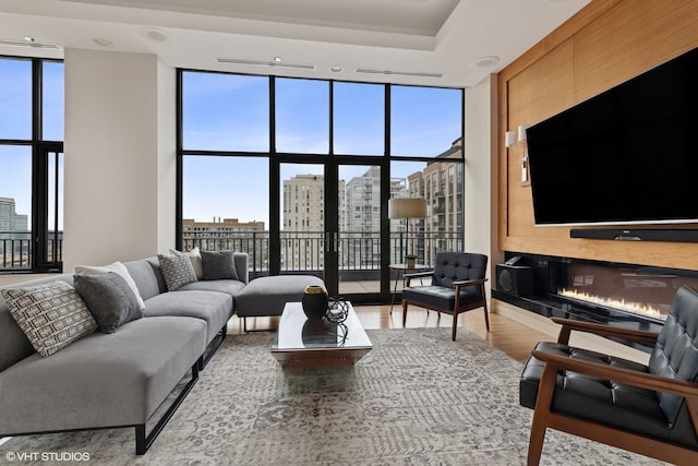 400 W Ontario St Unit 1801, Chicago, IL 60654 - living room with expansive windows, a city view, and wood finished floors