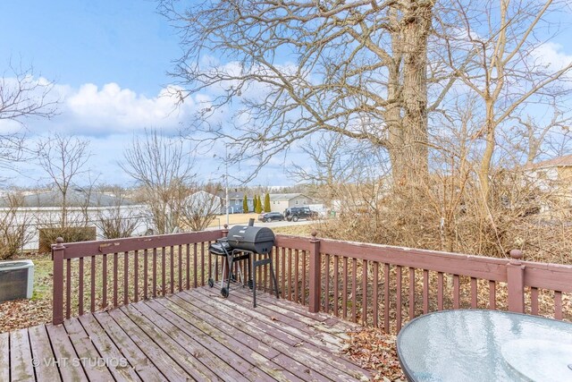 wooden deck with grilling area