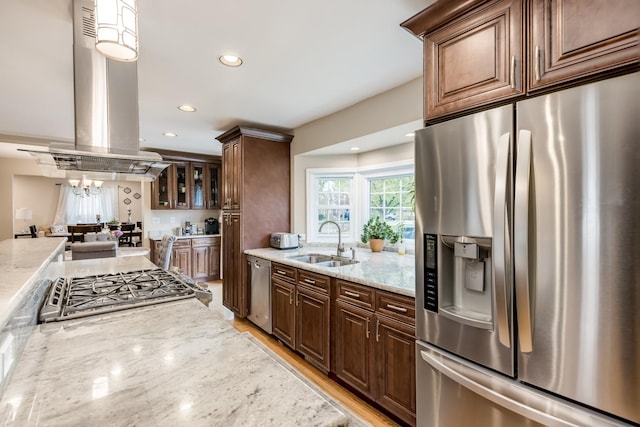 6700 N Monticello Ave, Lincolnwood, IL 60712 - kitchen with island exhaust hood, appliances with stainless steel finishes, a sink, and light stone counters