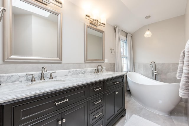 6700 N Monticello Ave, Lincolnwood, IL 60712 - bathroom featuring double vanity, tile walls, a sink, and lofted ceiling