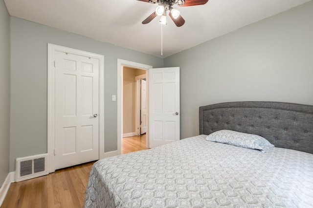 6700 N Monticello Ave, Lincolnwood, IL 60712 - bedroom with baseboards, visible vents, ceiling fan, and light wood finished floors
