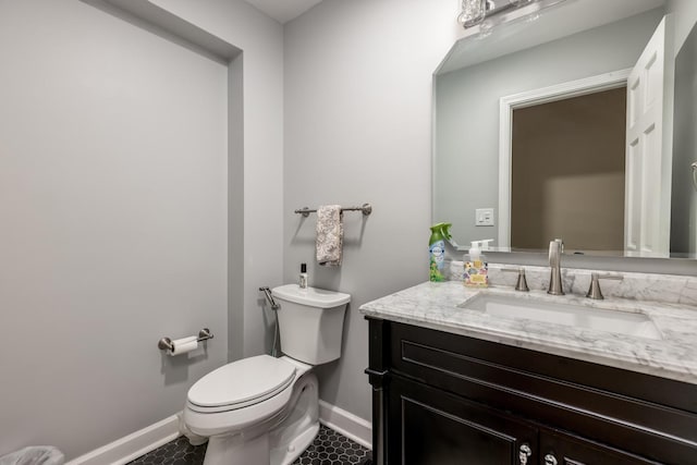 6700 N Monticello Ave, Lincolnwood, IL 60712 - bathroom with toilet, baseboards, tile patterned floors, and vanity