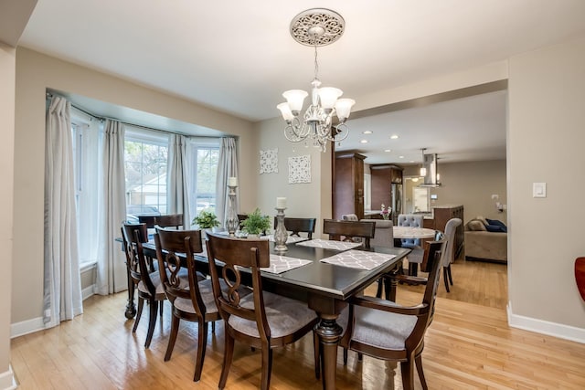 6700 N Monticello Ave, Lincolnwood, IL 60712 - dining area featuring recessed lighting, baseboards, an inviting chandelier, and light wood-style flooring