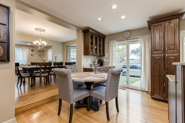 6700 N Monticello Ave, Lincolnwood, IL 60712 - dining area with recessed lighting, a notable chandelier, plenty of natural light, and light wood finished floors
