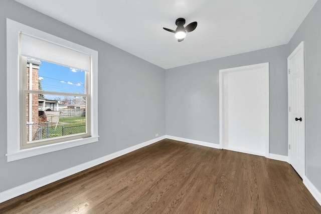 7315 S California Ave, Chicago, IL 60629 - empty room with baseboards, dark wood-style flooring, and ceiling fan