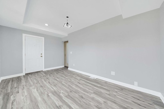 7315 S California Ave, Chicago, IL 60629 - unfurnished room featuring light wood-style floors, baseboards, an inviting chandelier, and recessed lighting