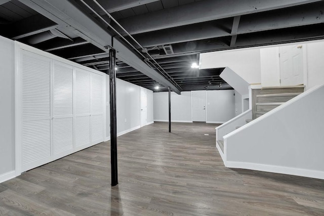 7315 S California Ave, Chicago, IL 60629 - finished below grade area with baseboards, stairs, and wood finished floors