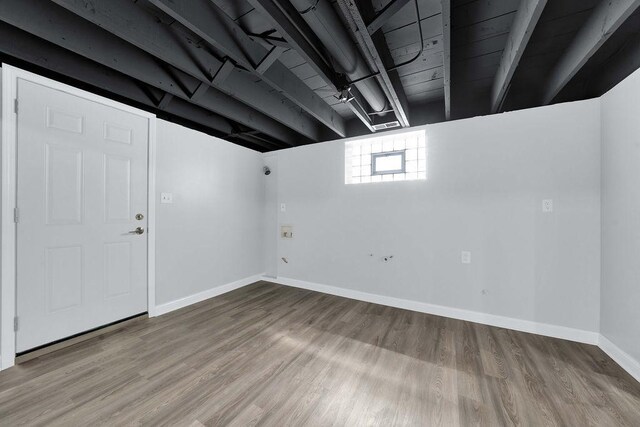 7315 S California Ave, Chicago, IL 60629 - below grade area with baseboards and wood finished floors