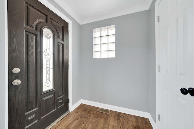 7315 S California Ave, Chicago, IL 60629 - entryway featuring baseboards, dark wood-type flooring, and visible vents