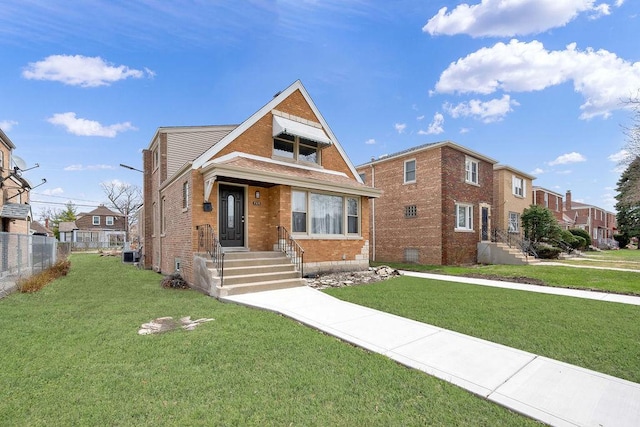 7315 S California Ave, Chicago, IL 60629 - view of front facade featuring fence, a front lawn, and brick siding