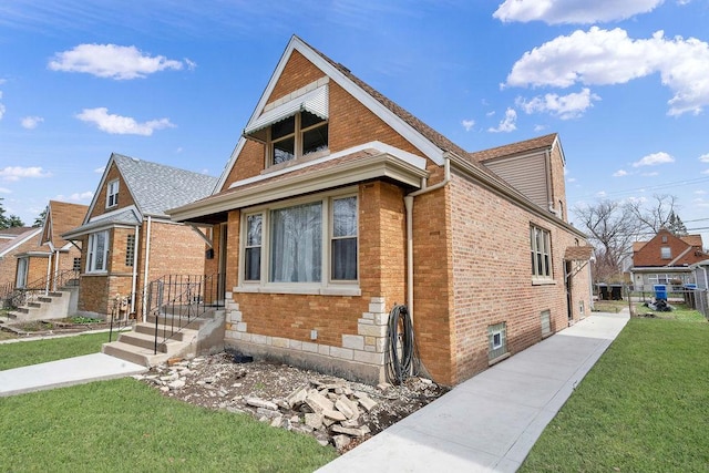 7315 S California Ave, Chicago, IL 60629 - bungalow-style home with brick siding and a front lawn
