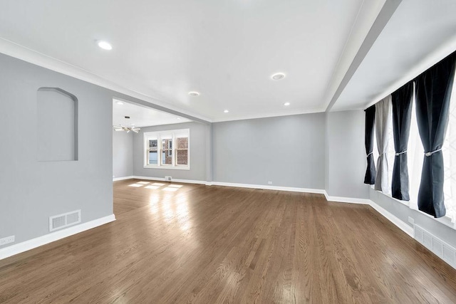 7315 S California Ave, Chicago, IL 60629 - unfurnished living room with baseboards, visible vents, and wood finished floors