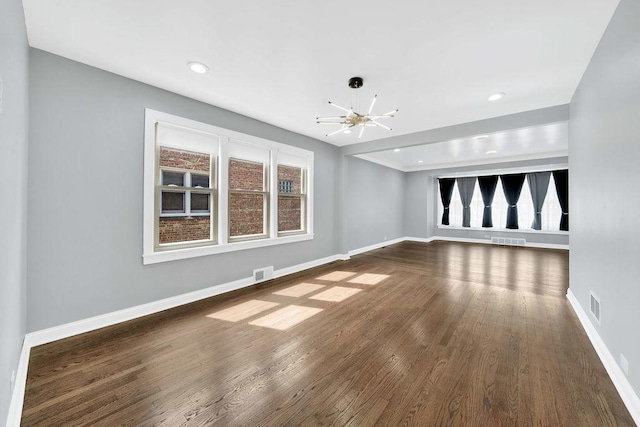 7315 S California Ave, Chicago, IL 60629 - unfurnished living room with baseboards, a chandelier, and visible vents