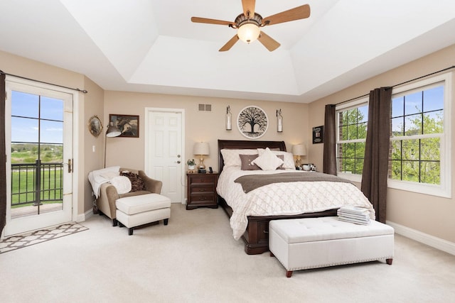 7659 Fairway Dr, Yorkville, IL 60560 - carpeted bedroom featuring access to outside, baseboards, a tray ceiling, and visible vents