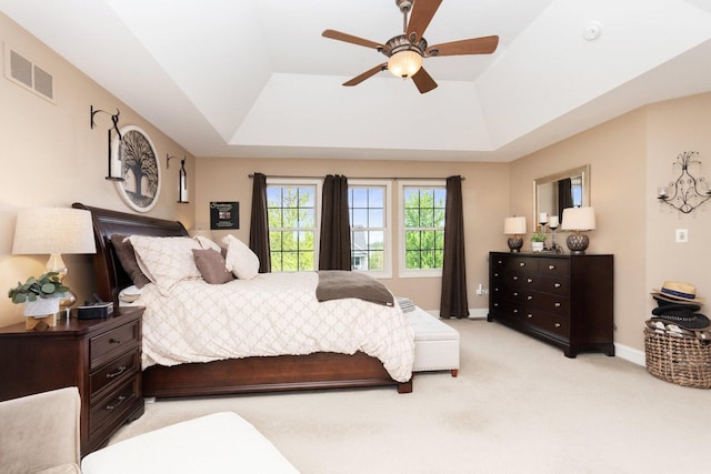 7659 Fairway Dr, Yorkville, IL 60560 - bedroom with a tray ceiling, visible vents, light carpet, and baseboards