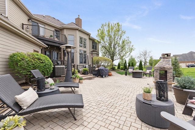 7659 Fairway Dr, Yorkville, IL 60560 - view of patio with a multi sided fireplace and a balcony