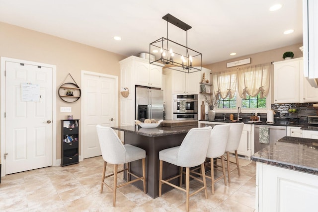 7659 Fairway Dr, Yorkville, IL 60560 - kitchen with recessed lighting, appliances with stainless steel finishes, a breakfast bar, and tasteful backsplash