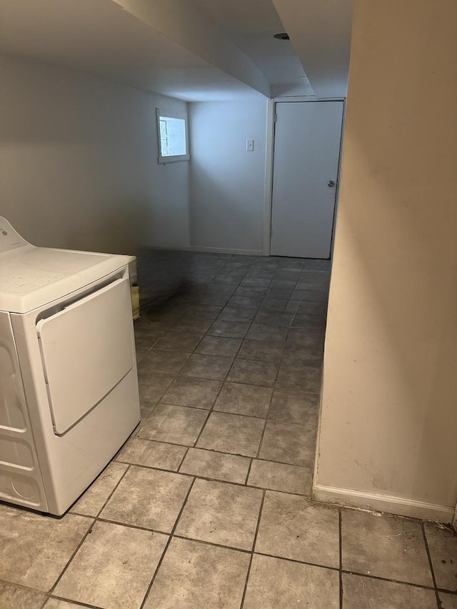 laundry area with light tile patterned floors, laundry area, and washer / clothes dryer