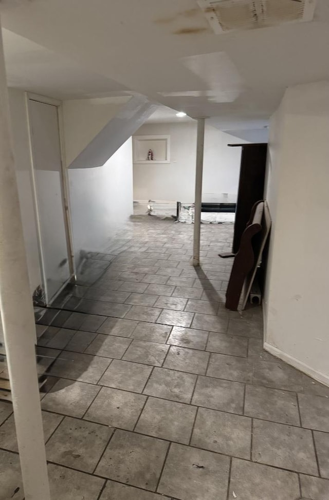 finished basement featuring visible vents