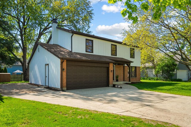 view of front of house with concrete driveway, a chimney, brick siding, and an attached garage
