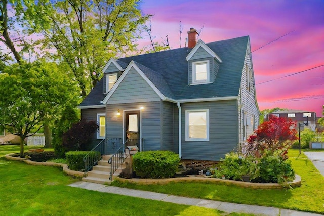 12540 S Tripp Ave, Alsip, IL 60803 - new england style home featuring a front yard, a chimney, and a shingled roof