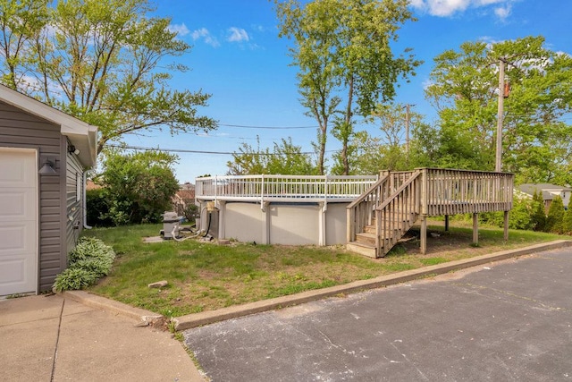 12540 S Tripp Ave, Alsip, IL 60803 - view of grassy yard featuring a wooden deck, an outdoor pool, and stairs