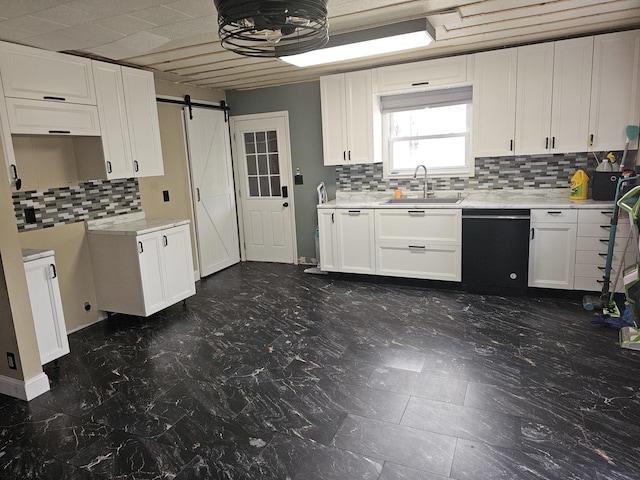 1208 Minkel St, Rock Falls, IL 61071 - kitchen featuring decorative backsplash, black dishwasher, a barn door, white cabinets, and a sink