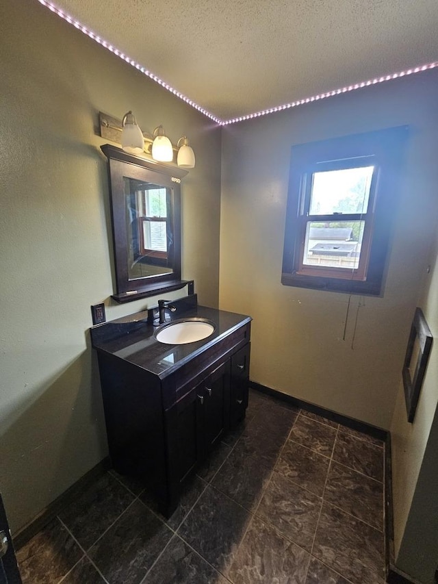 1208 Minkel St, Rock Falls, IL 61071 - bathroom featuring vanity, baseboards, and a textured ceiling