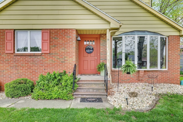 entrance to property with brick siding