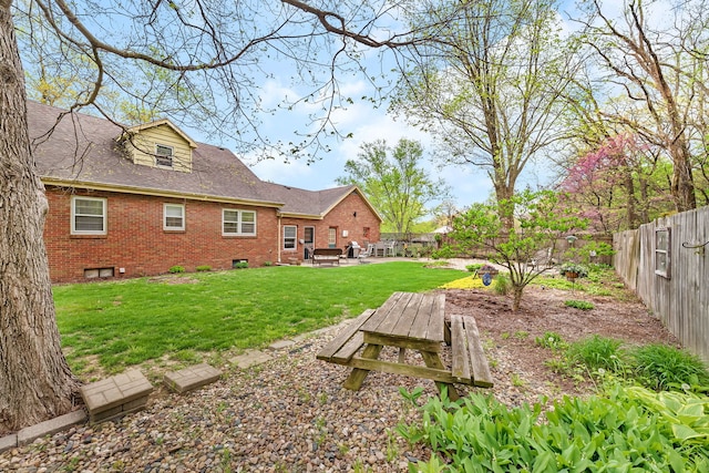 view of yard with a patio area and a fenced backyard
