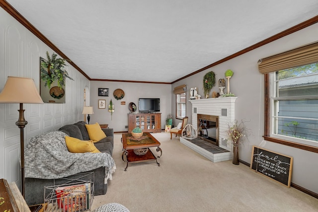 carpeted living area featuring baseboards, a fireplace, and crown molding