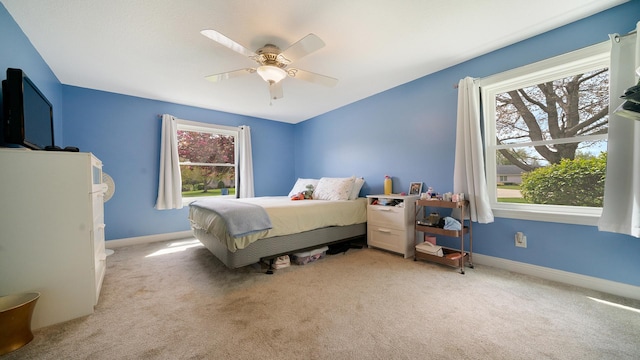 bedroom with carpet floors, baseboards, and a ceiling fan
