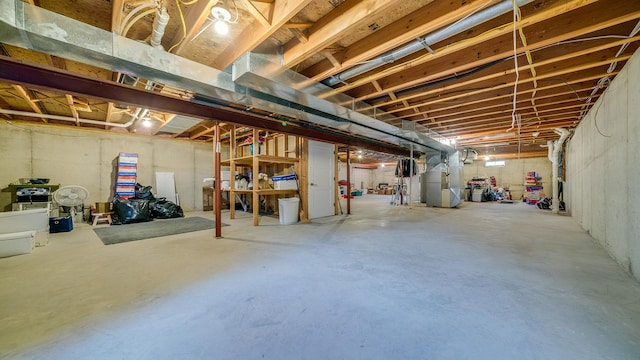 unfinished basement featuring heating unit